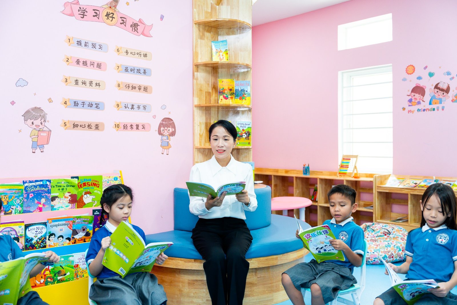 A teacher and children reading together